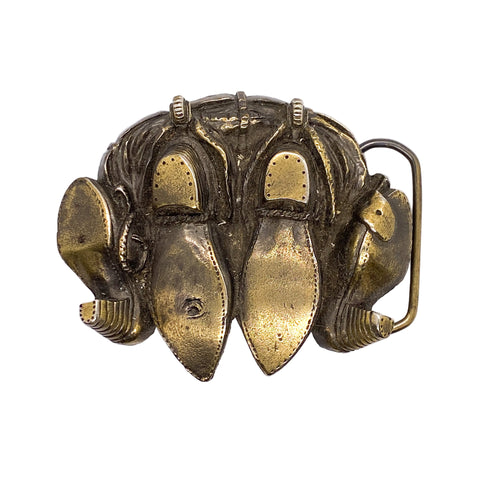 Bronze belt buckle with shoe design on a white background