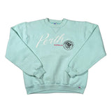 A light mint green crewneck sweatshirt laid flat on a light gray background. The front features 'Perth' in white script with 'AUSTRALIA' in red underneath, alongside a circular black and white graphic.