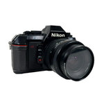 Nikon camera with lens on a white background