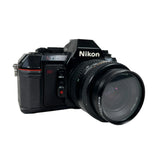 Nikon camera with lens on a white background