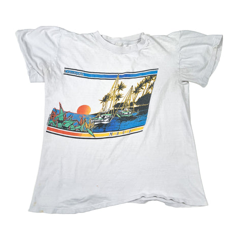 White t-shirt with a colorful graphic of a tropical scene on a white background