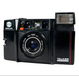 Minolta TALKER auto-focus camera on a white background