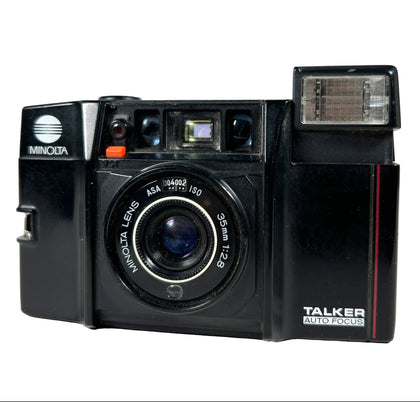 Minolta TALKER auto-focus camera on a white background