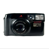 Black Pentax camera with 'iOZ zoom 700' on a white background