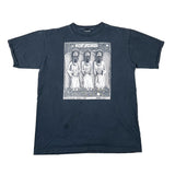 A faded dark blue short-sleeve t-shirt with a large white graphic print on the front showing three hooded religious figures and the text 'Holy Trinity'.