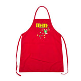 A red apron with a M&M's logo and candy print on the chest, laid flat on a white surface.