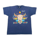 A navy blue short-sleeve t-shirt with a colorful graphic of a bull skull, a sun, and geometric patterns, featuring the text 'Arizona' on the chest, laid flat on a white surface.