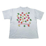 A light gray short-sleeve t-shirt with a graphic of colorful 3D spheres and the text 'This Shirt Is Full Of Holes.' printed on the front, laid flat on a white surface.