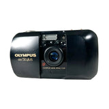 Black Olympus Stylus camera on a white background