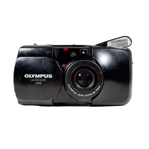 Black Olympus camera on a white background