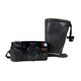 Black Olympus camera with a black carrying case on a white background