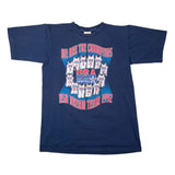 A vintage navy blue short-sleeve t-shirt featuring a 'USA Dream Team 1992' graphic on the front, laid flat on a white background.