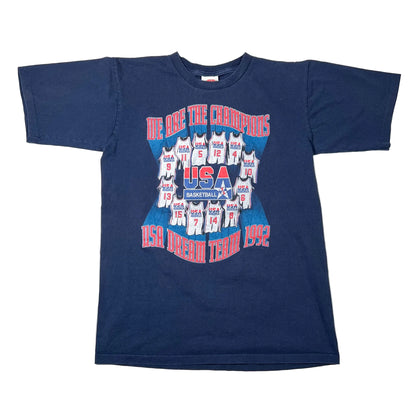 A vintage navy blue short-sleeve t-shirt featuring a 'USA Dream Team 1992' graphic on the front, laid flat on a white background.