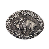 An oval silver-toned metal buckle featuring a raised bison profile surrounded by an ornate floral scroll border, shown on a plain white background.