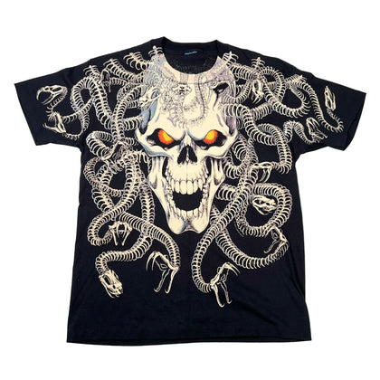 A black short-sleeve graphic T-shirt laid flat on a white surface, featuring a large skull and snake design with glowing orange eyes.
