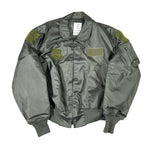 Green bomber jacket with green patches on a white background