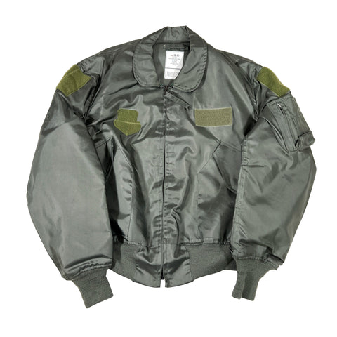 Green bomber jacket with green patches on a white background