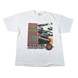 A white short-sleeve graphic t-shirt laid flat on a light gray surface. The shirt features a large front print for 'Bristol International Raceway' with 'Food City 500' text in red, green, and blue, alongside a vintage car photo and a circular Bristol Racing logo.