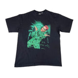 Black t-shirt with a graphic design of a person in a green outfit on a white background