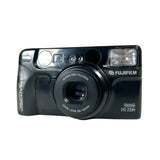 Black Fujifilm camera on a white background