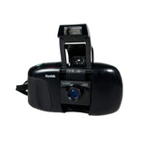 Black Kodak camera on a white background
