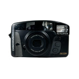 Black Fujifilm camera with 'Discovery' branding on a white background