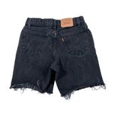 Black denim shorts with frayed edges on a white background