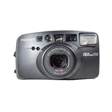 Pentax IQ Zoom 140 camera on a white background