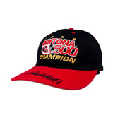 Black and red cap with 'Daytona 500 Champion' text on a white background