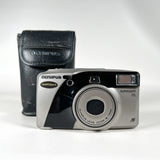 An Olympus Superzoom 115 film camera in silver and black, shown with its black leather carrying case on a white background.