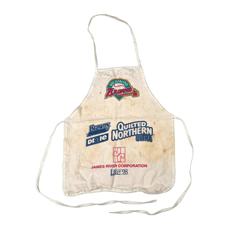 Vintage apron with multiple brand logos on a white background