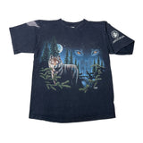 A vintage dark navy blue t-shirt featuring a graphic print of a wolf in a pine forest under a full moon, with a large wolf's eyes in the starry sky. The right sleeve features a white circular logo with the word 'ARIZONA'.