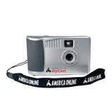 Silver digital camera with 'America Online' strap on a white background
