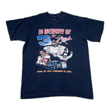 Navy blue t-shirt with a graphic of a racing driver and text on a white background