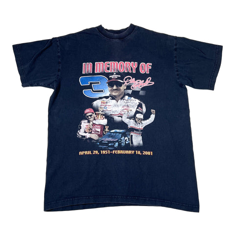 Navy blue t-shirt with a graphic of a racing driver and text on a white background