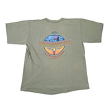 An olive green short-sleeve t-shirt laid flat on a white surface, featuring a large circular graphic on the back with the text 'Harley-Davidson Shop' and 'Crescent River, Florida'.