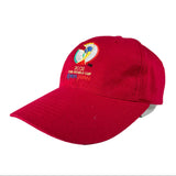 A red baseball cap featuring the embroidered 2002 FIFA World Cup in Japan logo on the front, set against a plain light gray background.