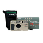 Yashica camera with carrying case and packaging on a white background
