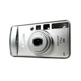 Canon Sure Shot 115u camera on a gray background