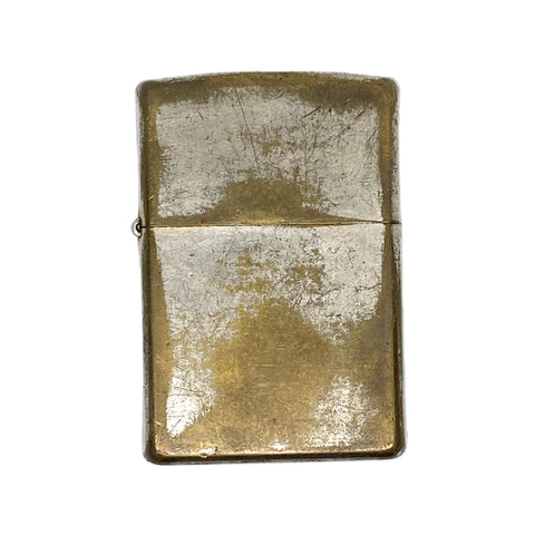 Vintage brass lighter on a white background