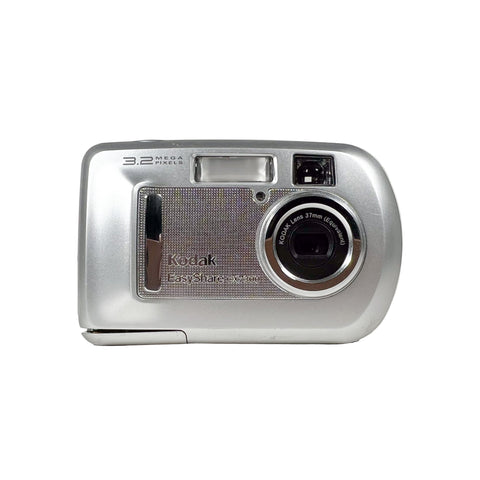 Silver Kodak digital camera on a white background