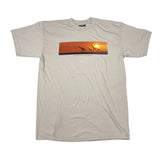 Beige t-shirt with a graphic of giraffes at sunset on a white background