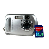 A silver Kodak EasyShare C300 digital camera shown next to a SanDisk 64MB SD card on a light gray background.