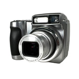Silver digital camera on a light gray background