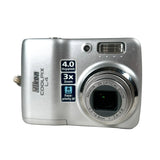 Silver Nikon digital camera on a white background