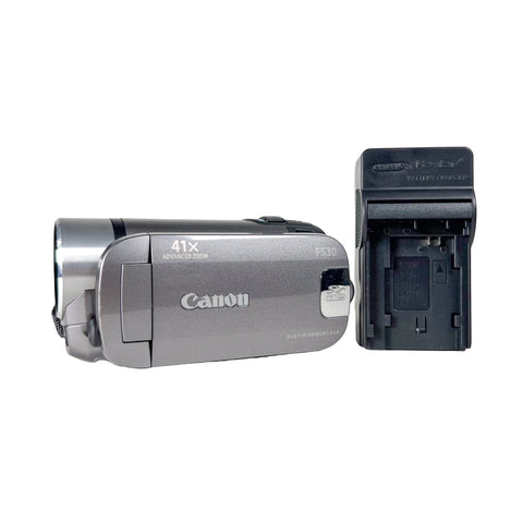 Canon video camera with battery pack on a white background
