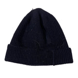 Black knitted beanie on a white background