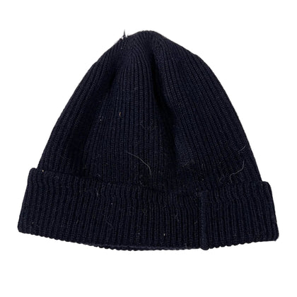 Black knitted beanie on a white background