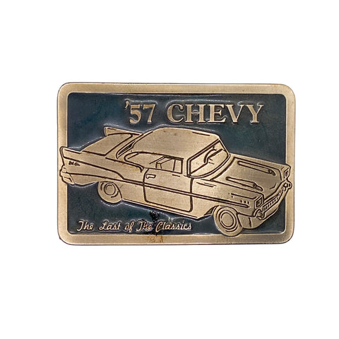 Bronze belt buckle with '57 Chevy design on a white background