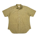 Green short-sleeve shirt on a white background